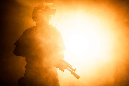 Russian special forces operator in bulletproof helmet in the smoke and fire
