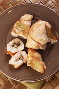 Chicken roulades with mushrooms, marinated cucumbers and yellow cheese