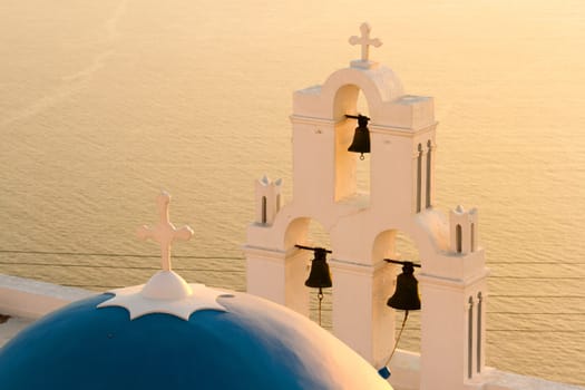 Famous church in Fira, Santorini at sunset