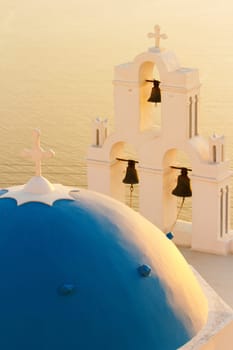 Famous church in Fira, Santorini at sunset