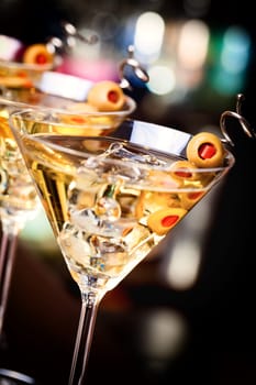 Several glasses of famous cocktail Martini, shot at a bar with shallow depth of field..Ingredients