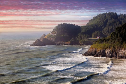 Heceta Head Lighthouse on the cliff of Devil’s Elbow State Park State Scenic Viewpoint at Sunset