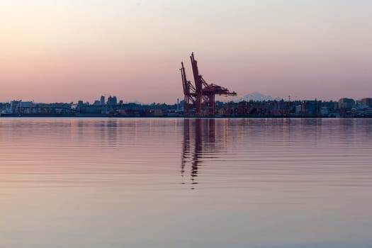 Sunrise at Port of Vancouver British Columbia Canada with Water Reflection