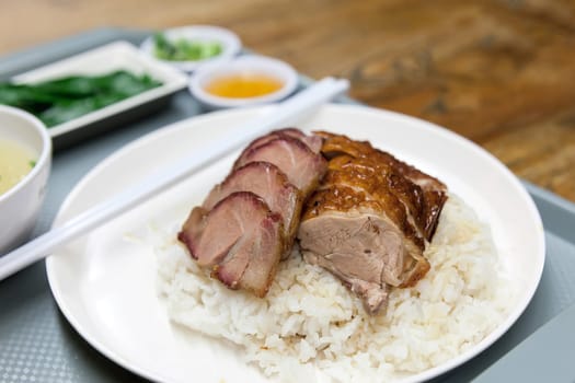 Roast Duck and Barbecue Pork Over Rice Dish in Hong Kong Restaurant Macro