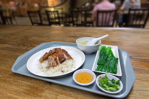 Roast Duck and Barbecue Pork Over Rice Dish Set in Hong Kong Restaurant Food Court