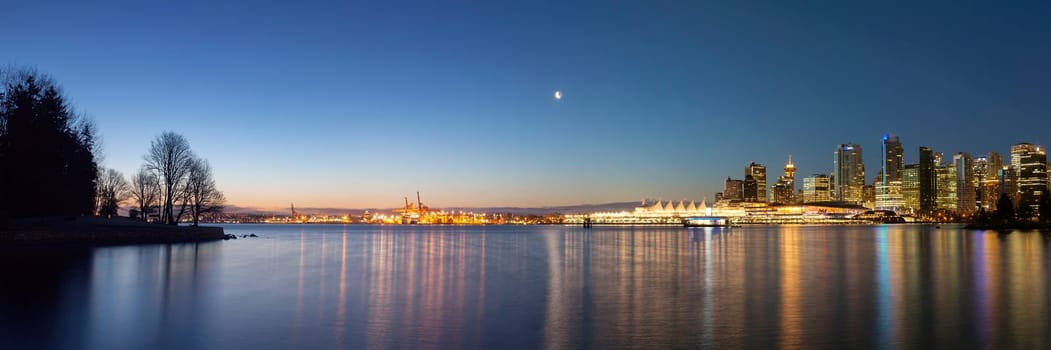 Vancouver British Columbia Canada City Lights and Skyline from Stanley Park at Dawn Blue Hour Panorama