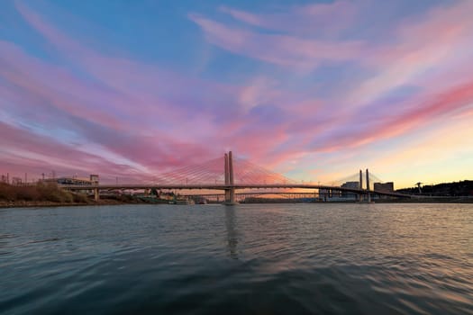 Tilikum Crossing and Ross Island Bridge Over Willamette River in Portland Oregon during Sunset