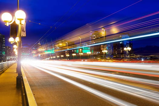 Rush Hour Traffic Light Trails on Cambie Bridge in Vancouver British Columbia Canada during Evening Blue Hour