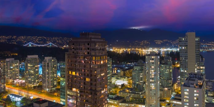 Vancouver British Columbia Canada Cityscape with Street Light Trails Stanley Park Grouse Mountain View at Dusk