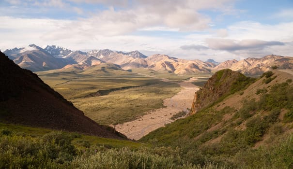 Puffy clouds and blue sky of the Alaska Range in Denali National Park