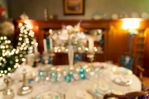 Christmas Day Holiday Celebration Dinner Table Decorations Blurred Defocused Bokeh Background