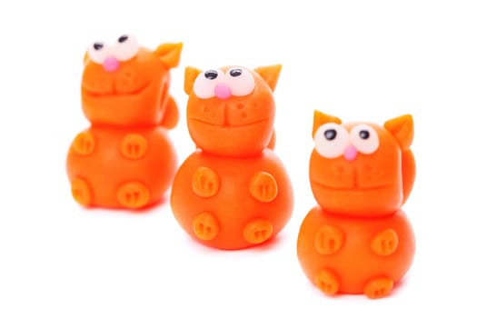 Orange cats made of polymer clay