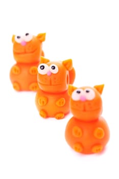 Orange cats made of polymer clay