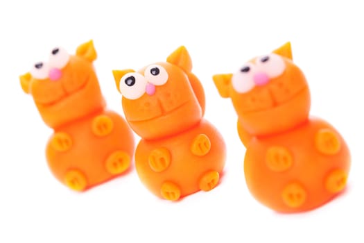 Orange cats made of polymer clay