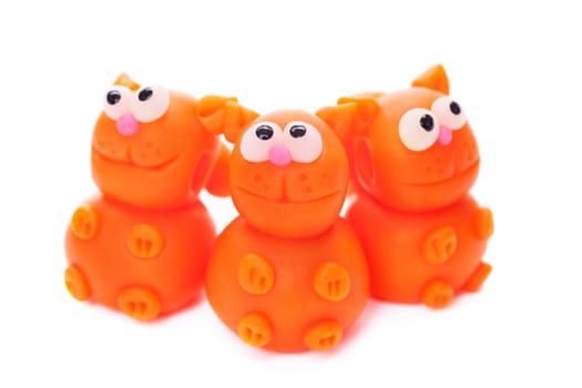 Orange cats made of polymer clay