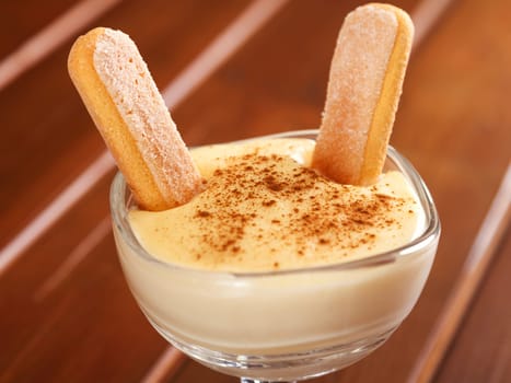 Homemade vanilla cream with biscotti and cinnamon