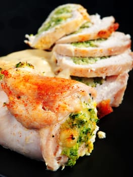 Stuffed chicken rolls with broccoli and vegetables
