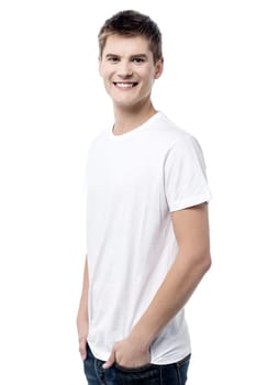 Side pose of casual male with hands in pockets