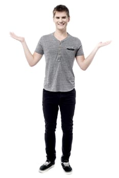 Full length of handsome male welcome with smile