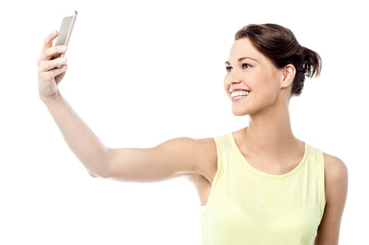 Cheerful woman taking a picture of herself