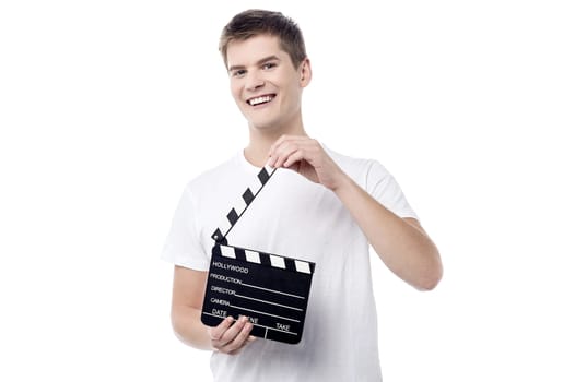 Cheerful young male with open film slate