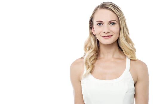 Beautiful young woman looking at camera over white