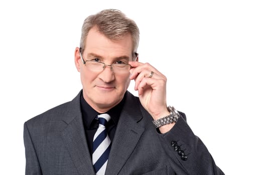 Business person adjusting his eyeglasses