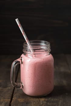 Pink healthy smoothie with yoghurt and berries