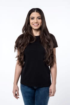 Casual pose of pretty young woman over white