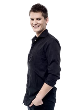 Confident handsome man with hands in pockets