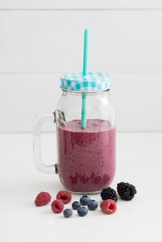 Pink healthy smoothie with yoghurt and berries