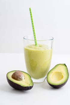 Green smoothie with avocado in the glass