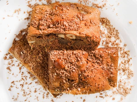 Chocolate brownie with nuts, close up