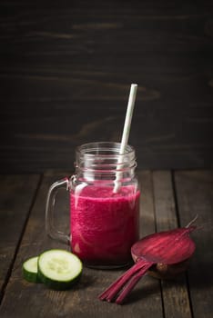 Red smoothie with beetroot and cucumber in a glass