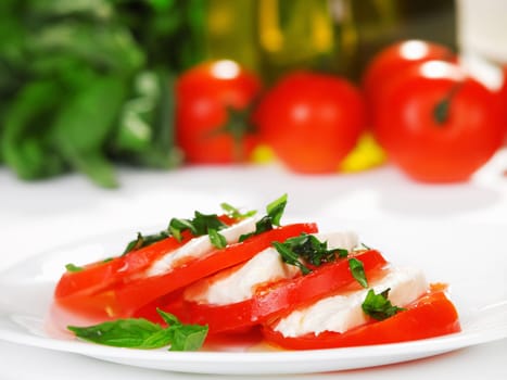 Caprese Salad is tomatoes with mozzarella and olive oil