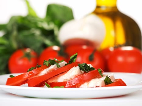 Caprese Salad is tomatoes with mozzarella and olive oil