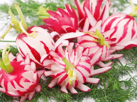 Food carving with radish made like flowers