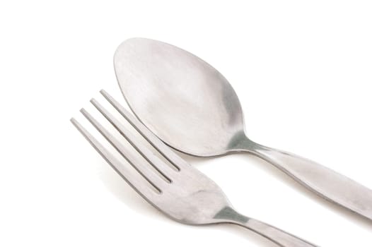 Old silver fork and spoon isolated on white background