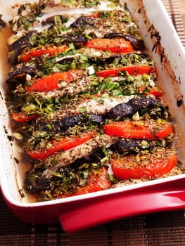 Baked eggplants with tomatos in a baking dish