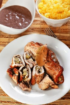 Pork roulades with mushrooms, marinated cucumbers and yellow cheese