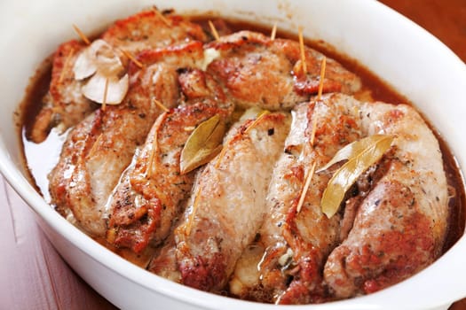 Pork roulades with mushrooms, marinated cucumbers and yellow cheese