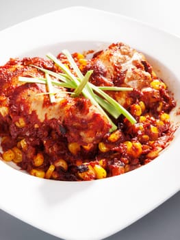 Mexican chicken with corn and tomatos