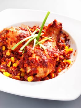 Mexican chicken with corn and tomatos