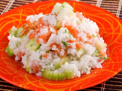 Rice with salmon and cucumbers salad