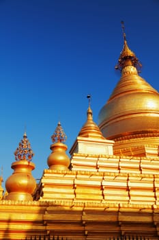 The Maha Lawka Marazein Pagoda at the center of the Kuthodaw Pagoda. Kuthodaw Pagoda is a Buddhist stupa, located in Mandalay, Burma (Myanmar), that contains the world's largest book. It lies at the foot of Mandalay Hill. In the grounds of the pagoda are 729 stone-inscription caves, each containing a marble slab inscribed on both sides with a page of text from the Tipitaka, the entire Pali Canon of Theravada Buddhism. Pagoda Kuthodaw stretching from 1860 to 1868 during the reign of King Mindona.