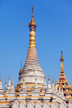Kuthodaw Pagoda is a Buddhist stupa, located in Mandalay, Burma (Myanmar), that contains the world's largest book. It lies at the foot of Mandalay Hill. In the grounds of the pagoda are 729 stone-inscription caves, each containing a marble slab inscribed on both sides with a page of text from the Tipitaka, the entire Pali Canon of Theravada Buddhism. Pagoda Kuthodaw stretching from 1860 to 1868 during the reign of King Mindona.