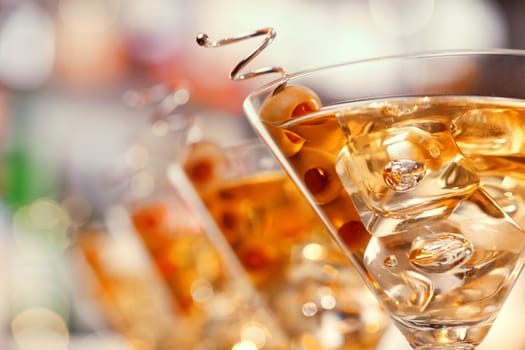 Several glasses of famous cocktail Martini, shot at a bar with shallow depth of field..Ingredients
