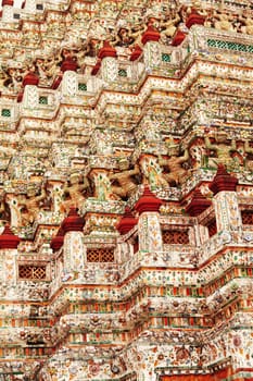Wat Arun Rajwararam or Temple of the Dawn is a Buddhist temple (wat) in the Bangkok Yai district of Bangkok, Thailand, on the Thonburi west bank of the Chao Phraya River. The full name of the temple is Wat Arunratchawararam Ratchaworamahawihan. Named after Aruna, the Indian God of Dawn, the Wat Arun is considered one of the most well known landmark of Thailand. The prangs are decorated by seashells and bits of porcelain which had previously been used as ballast by boats coming to Bangkok from China.