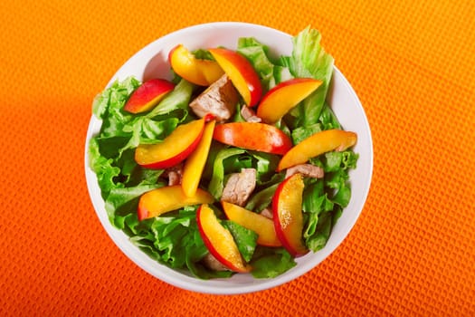 Chicken salad with peaches and green salad