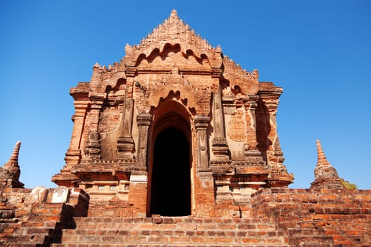 Ancient pagoda in Bagan, blue sky in background